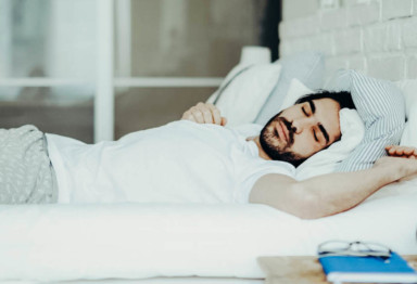 A person asleep in bed