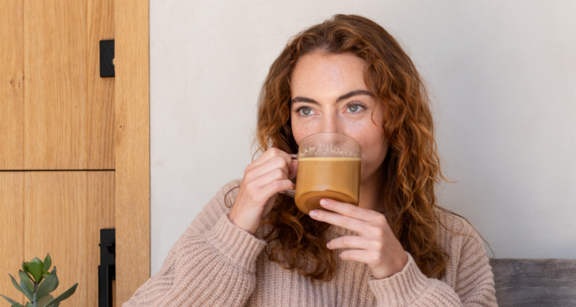 Young woman drinking Bulletproof Coffee.