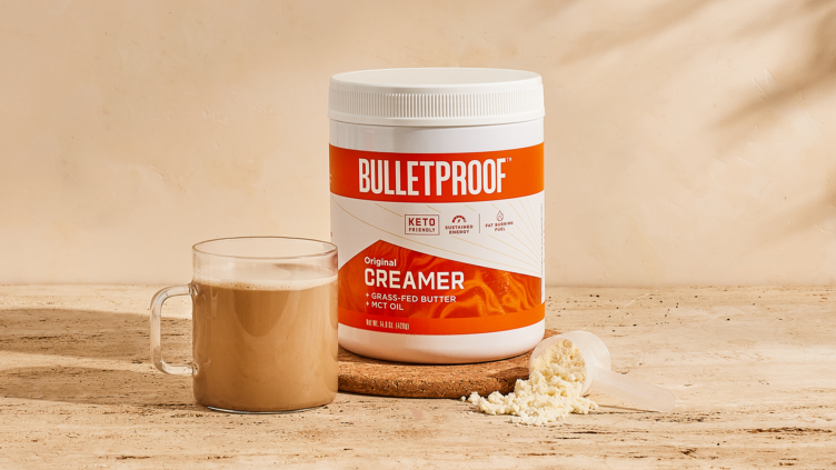 Woman holding a mug of Bulletproof Coffee