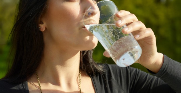 Woman drinking sparkling water