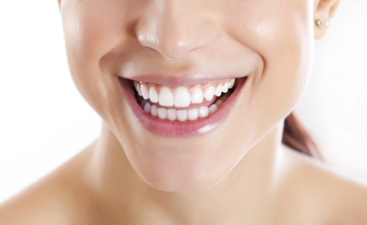 Why Coconut Oil Pulling Upgrades Your Teeth