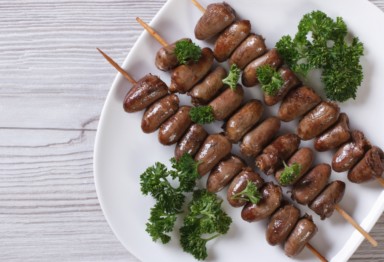 Chicken hearts on skewers with parsley
