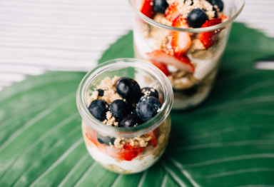 2 small cups with berries and grains