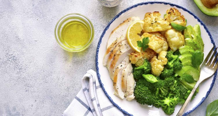 Chicken on plate of vegetables