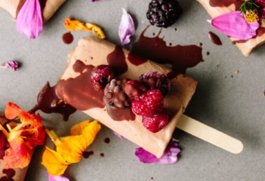 An ice cream bar decorated with berries