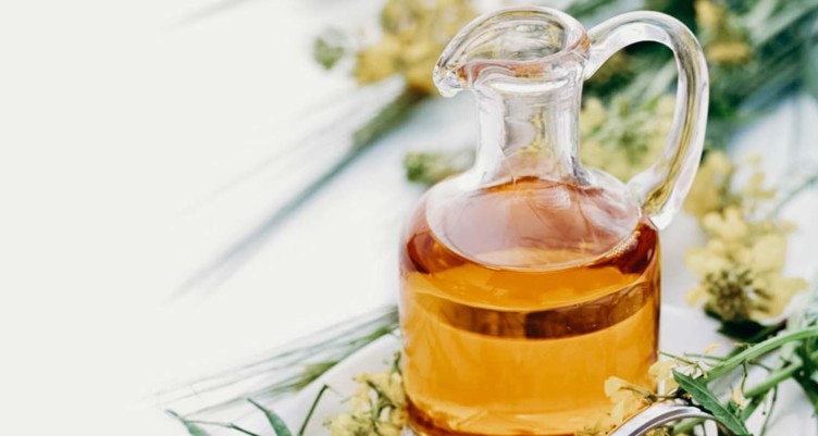 Glass jar of canola oil