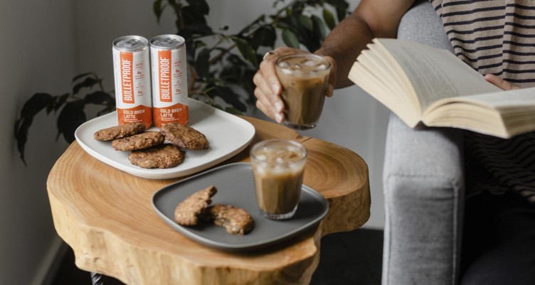 Bulletproof Cold Brew Latte with cookies on a side table
