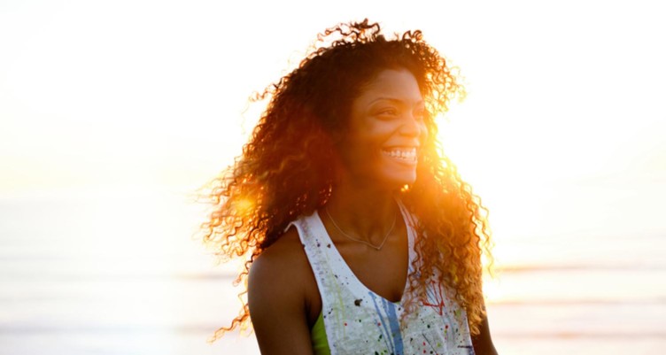 Woman smiling in sunlight