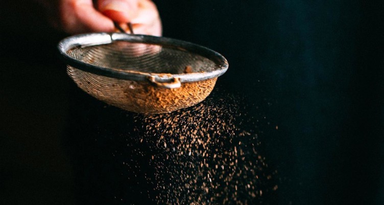 Hand sifting cinnamon
