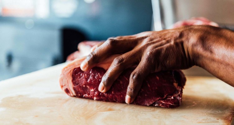 Man holding raw steak