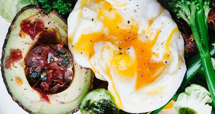 Avocado with bacon and runny egg