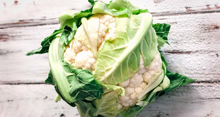 Head of cauliflower on table