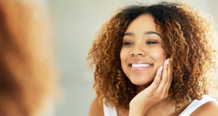 Woman smiling in mirror