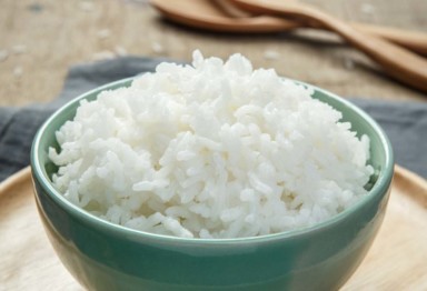 Bowl of white rice on plate