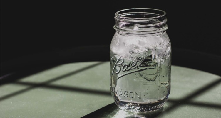 Jar of water next to window