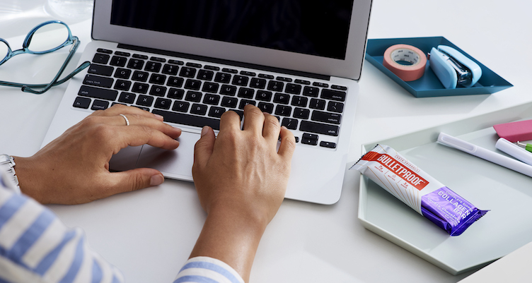 Chocolate Dipped Collagen Bar on desk