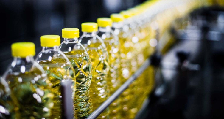 Row of canola oil bottles