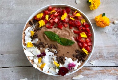 Chocolate smoothie bowl with coconut and berries