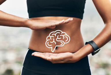 Hands around stomach with a brain icon overlaid
