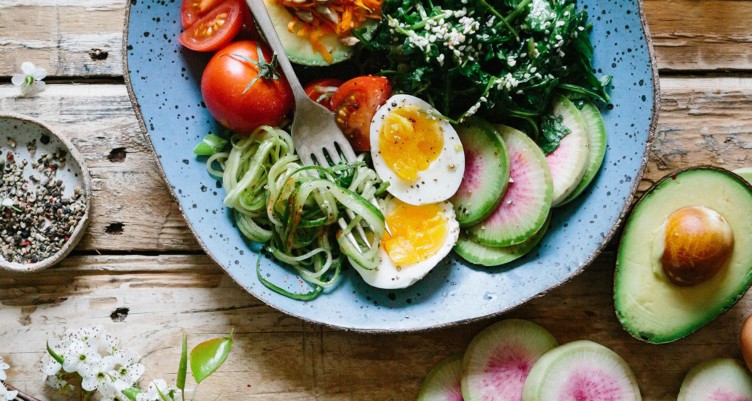 Plate full of vegetables and sliced eggs
