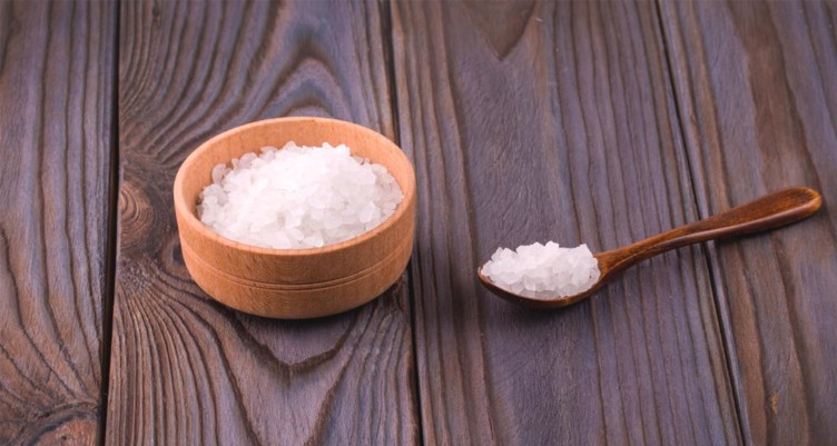 Bowl of epsom salt on wood table