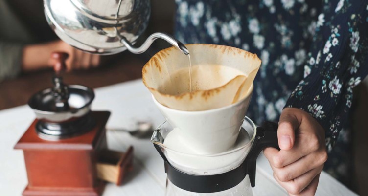 Person making pour over coffee