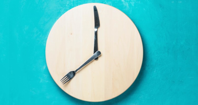 Fork and spoon on wooden plate