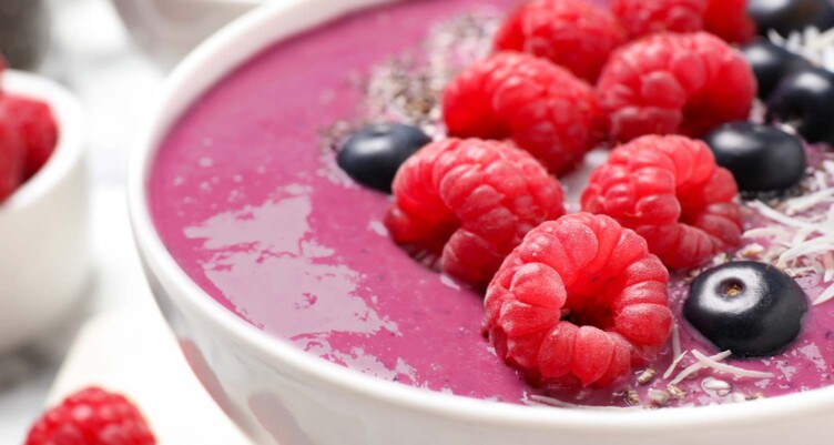 Close up of berries sitting in a bowl of cauliflower smoothie recipe
