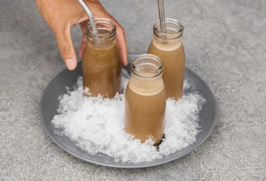 Jars of Keto Iced Coffee Protein Shake on ice