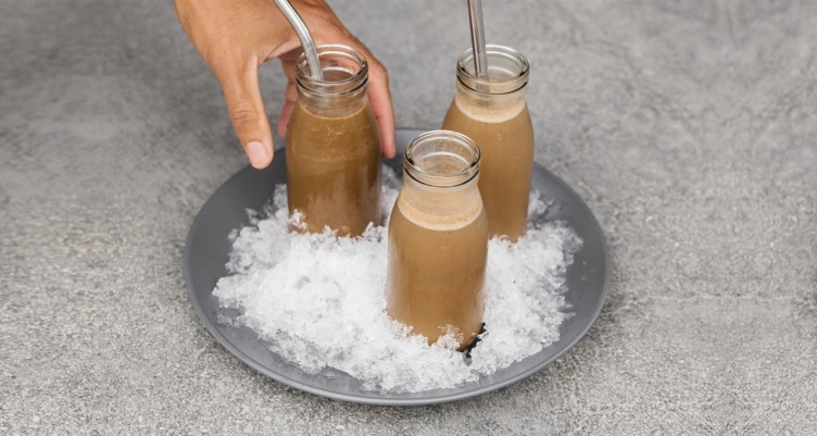 Jars of Keto Iced Coffee Protein Shake on ice