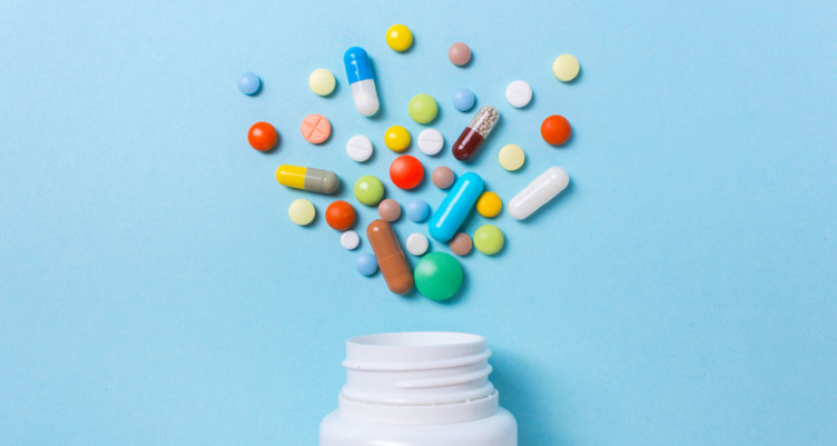 Pills coming out of bottle