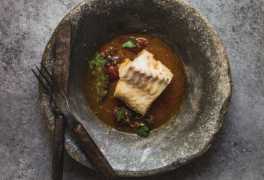 Poached cod in tomato broth