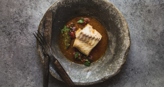Poached cod in tomato broth