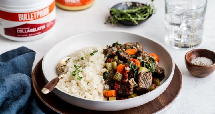 A plate of slow-cooked beef stew with cauliflower rice