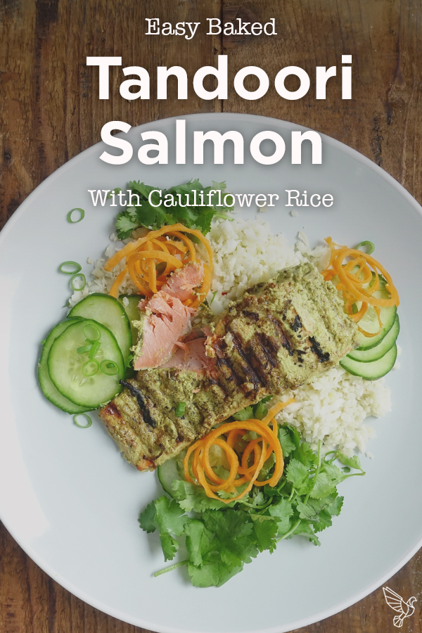 This creamy spiced tandoori salmon recipe with cauliflower rice comes together in minutes for a simple paleo, keto, and Whole30 weeknight dinner.