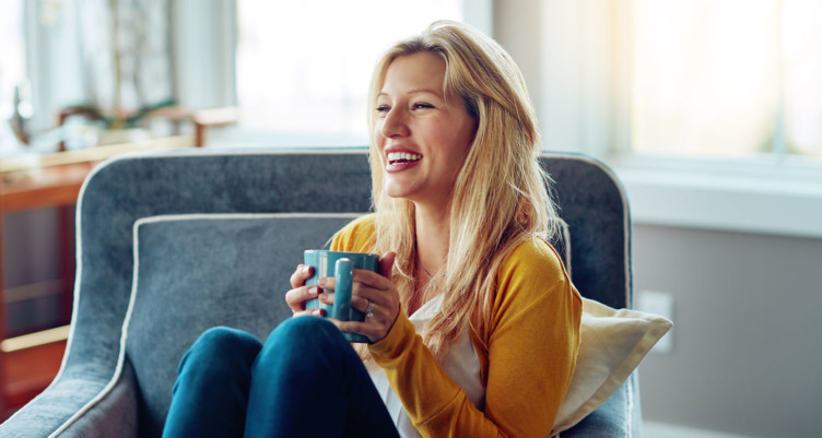 Woman holding mug of tea