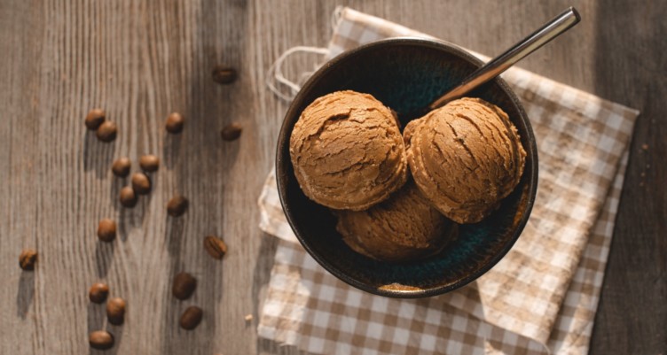 Keto coffee ice cream in a bowl with coffee beans