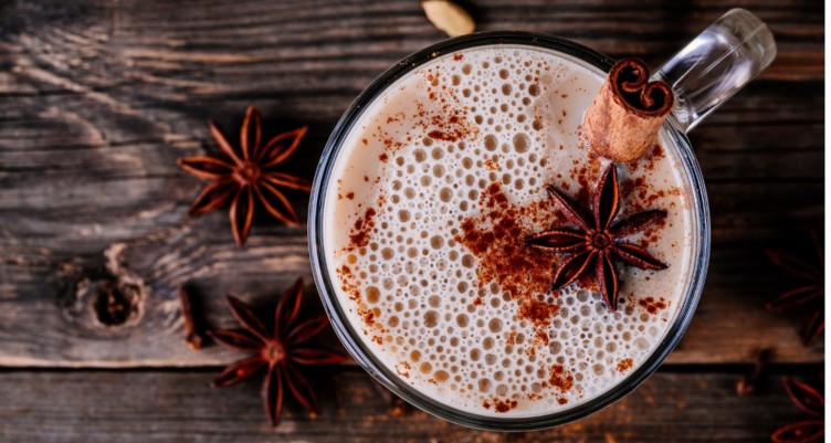 A spicy keto coffee in a mug with star anise