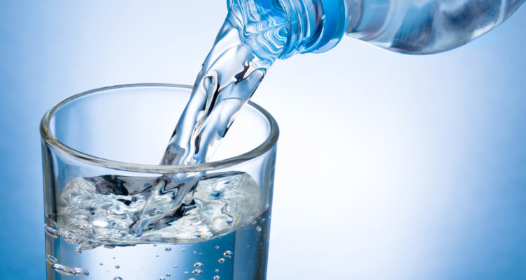 Pouring water into glass