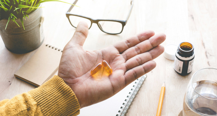 Hand with pills in palm