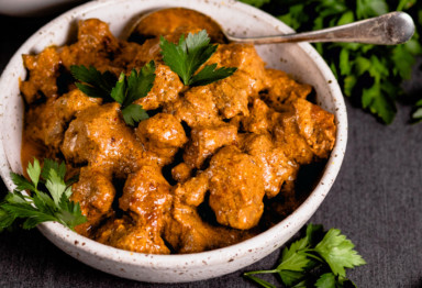 Bowl of beef curry with cilantro