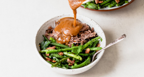 Creamy Paleo Onion Gravy over beef and vegetables