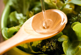 MCT oil in wooden spoon