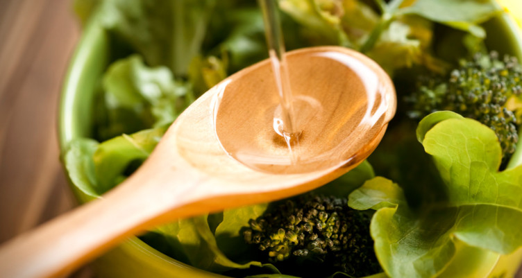 MCT oil in wooden spoon