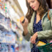 Woman looking at nutrition label