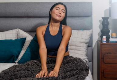 women sitting on bed