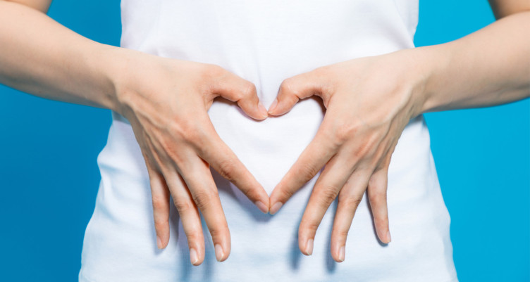 Hands making heart over belly