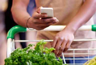 Person checking grocery list on phone