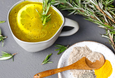 Mug of bone marrow broth with lemon slice