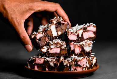 Hand grabbing a keto rocky road bars